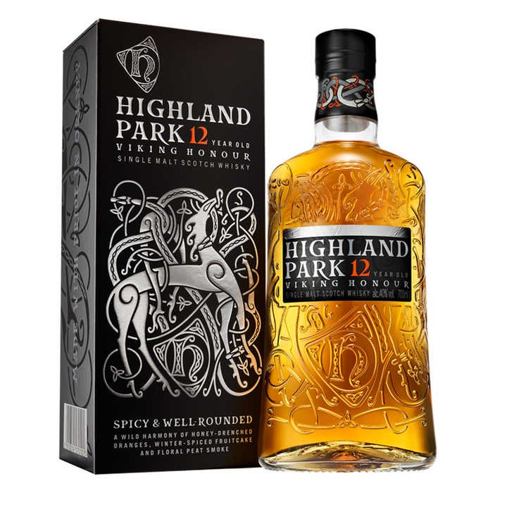 A bottle of Highland Park 12 Year Old Viking Honour Single Malt Scotch Whisky stands beside its black box, adorned with silver Viking-inspired artwork and bold text, representing its Orkney Islands heritage.
