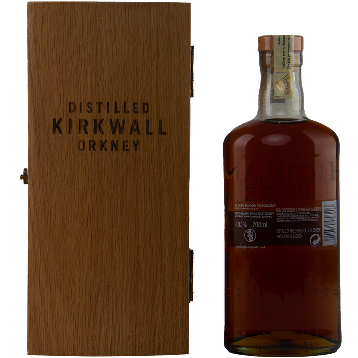 A bottle of Highland Park 30 Year Old Single Malt Whisky stands next to a closed wooden box labeled Distilled Kirkwall Orkney, featuring a sealed cap and clear rear label—an ideal addition to any collector’s whisky selection.