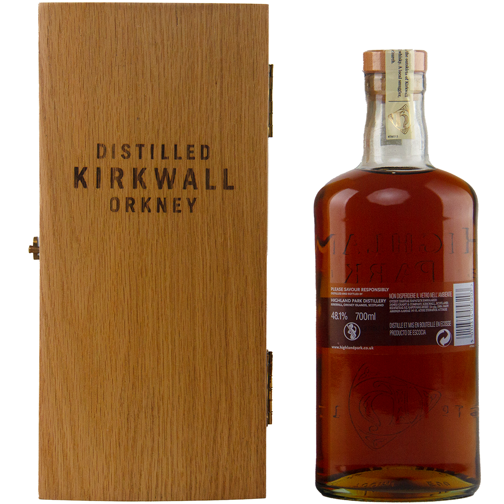 Whiskey bottle with wooden box labeled 'Distilled Kirkwall Orkney' on a white background