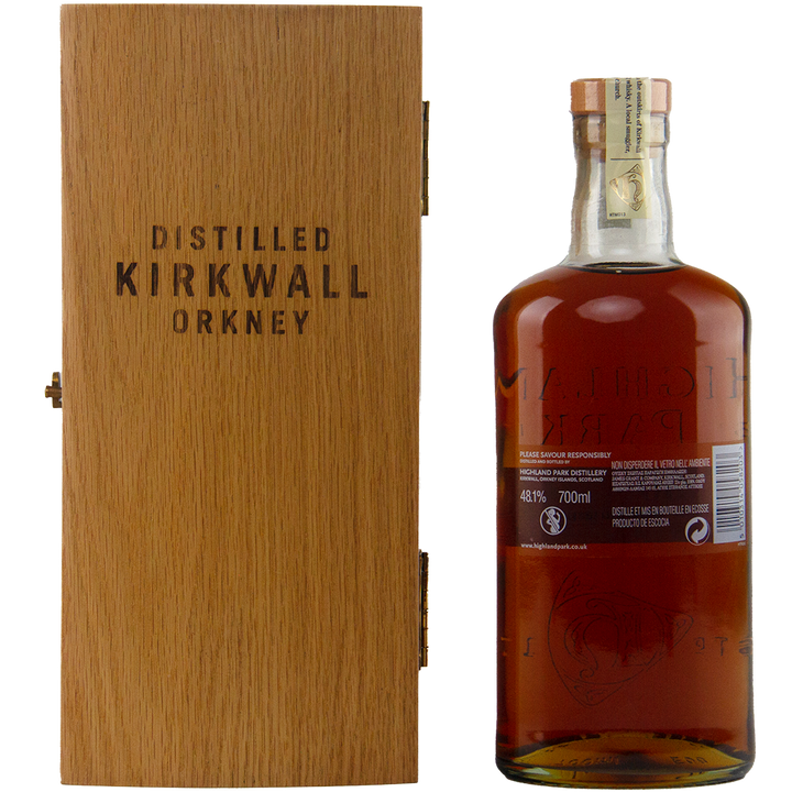 Whiskey bottle with wooden box labeled 'Distilled Kirkwall Orkney' on a white background
