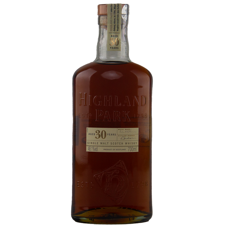 A bottle of Highland Park 30 Year Old Single Malt Whisky features amber liquid, embossed lettering, and a label displaying its age, 700ml volume, and 45.7% ABV—an exceptional collector’s whisky for connoisseurs.