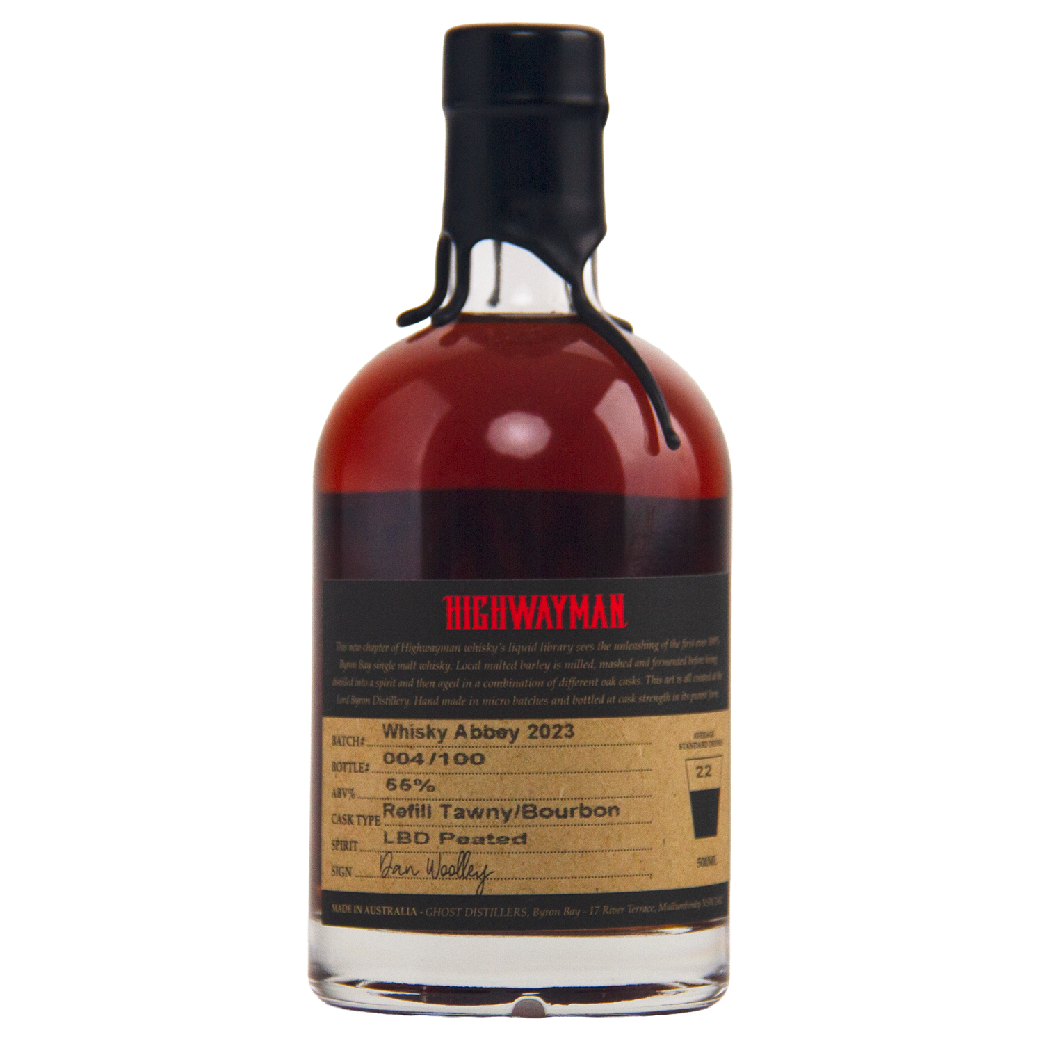 A limited-edition bottle of Highwayman Whisky Abbey 2023 features a black wax-sealed top, dark amber Australian whisky (56% ABV), cask type info, batch number, and a handwritten signature on the label.