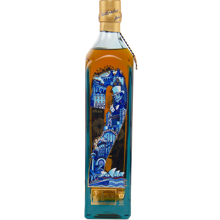A tall bottle of Johnnie Walker Blue Label 200th Anniversary whisky features an intricate blue and gold label with cityscape, waves, a top-hatted man, the numbers 1820, and gold seal accents—a true collectible whisky.