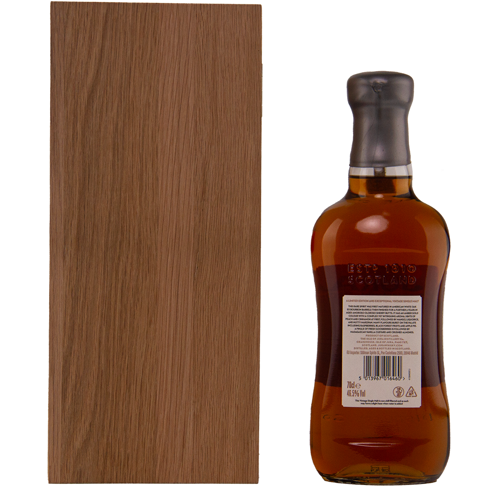A brown wooden box stands next to a bottle of Jura 1990 30 Year Old Single Malt Whisky with a wax-sealed top, viewed from the back. The bottle shows embossed text and a label with barcode and product details.