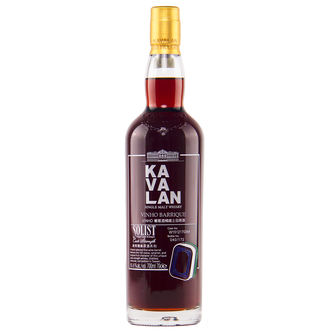 A bottle of Kavalan 2015 Vinho Barrique Cask No. W151217034A Taiwanese whisky with dark amber liquid, a gold cap, and a detailed label displaying white and gold English and Chinese text.