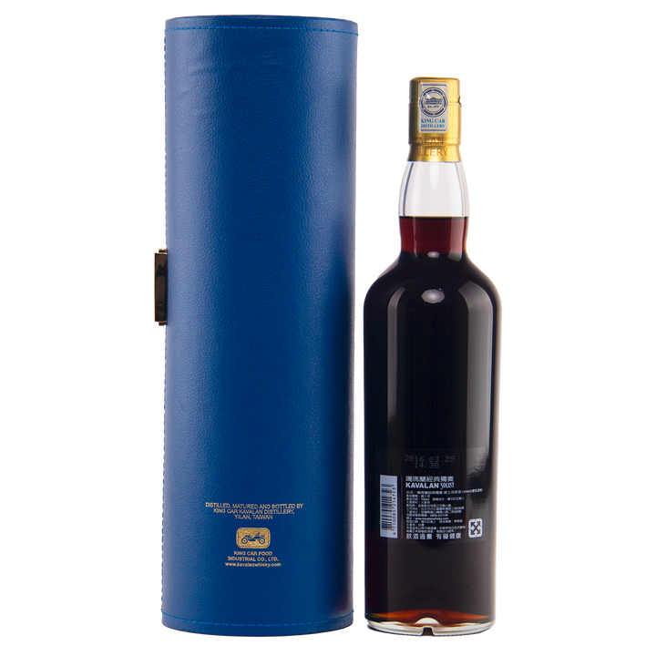 Bottle of whiskey with a blue cylindrical box on a white background