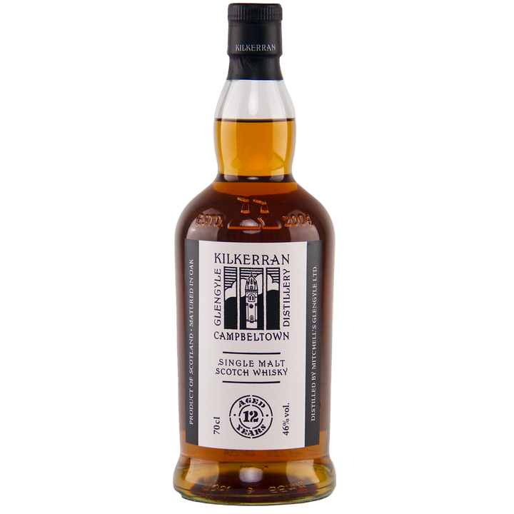 A bottle of Kilkerran 12 Year Old Single Malt Scotch Whisky with a white label, black text and graphics, amber liquid inside, aged 12 years, and bottled at 46% ABV.