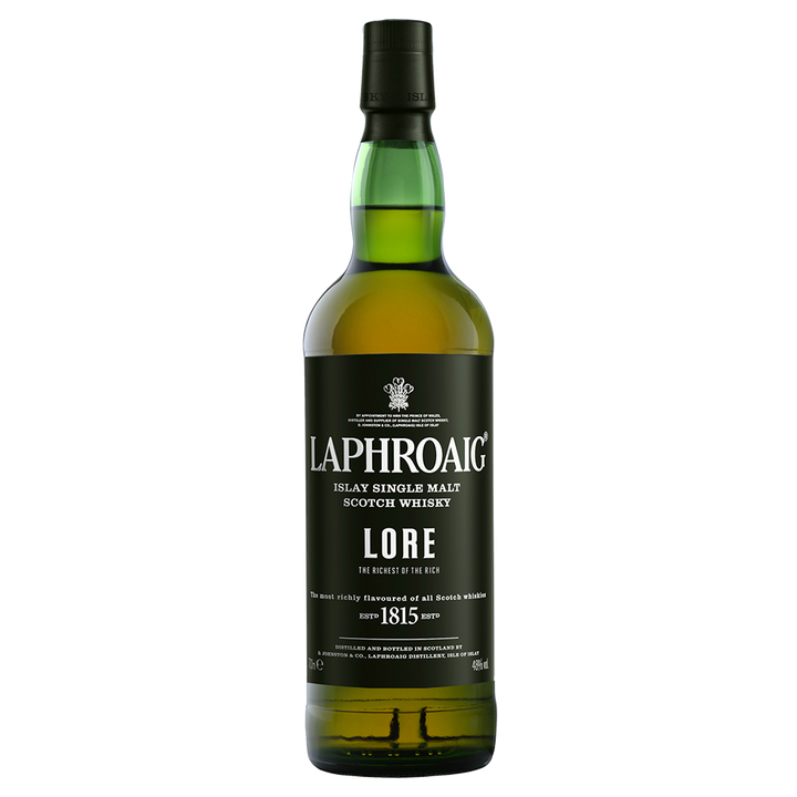 A green glass bottle of Laphroaig Lore Single Malt Scotch Whisky features a black label with the brand name and product details in white text.