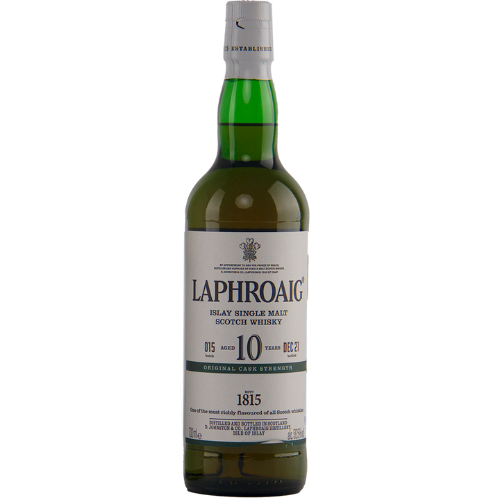 A bottle of Laphroaig 10 Year Old Cask Strength Batch 15 Islay whisky features a green glass body, white and gray label, white cap, and displays the brand name, age statement, cask strength, and other details on the label.