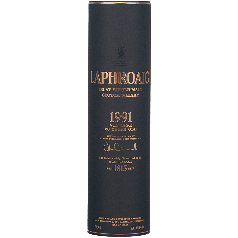 A cylindrical dark box with gold text houses the Laphroaig 1991 Vintage 23 Year Old Single Malt Whisky, featuring collector’s edition branding that highlights its heritage, quality, and cask strength.