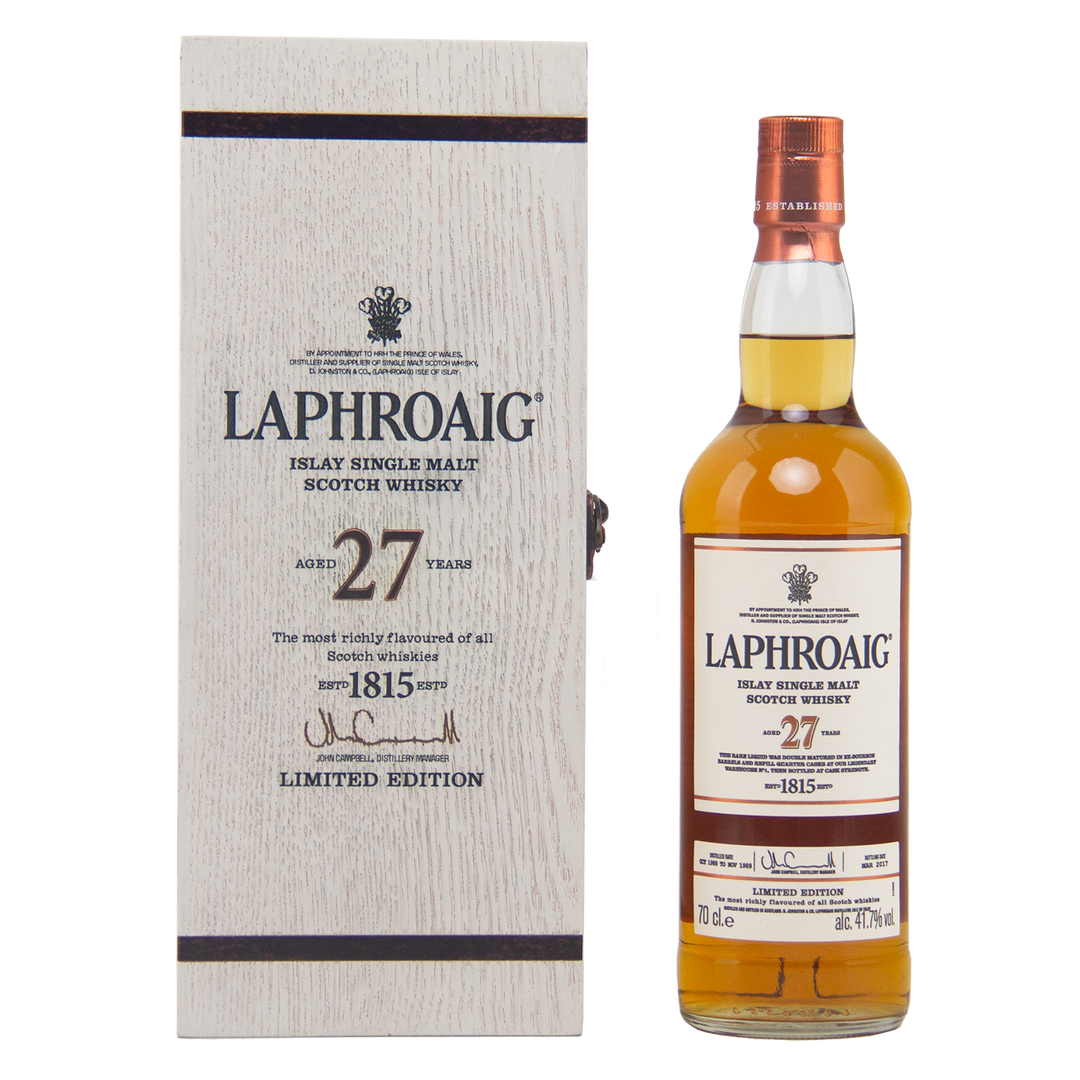 A bottle of Laphroaig 27 Year Old Single Malt Whisky stands by its light wood box, both marked as a limited edition—an extraordinary choice for collectors seeking investment-grade Scotch.