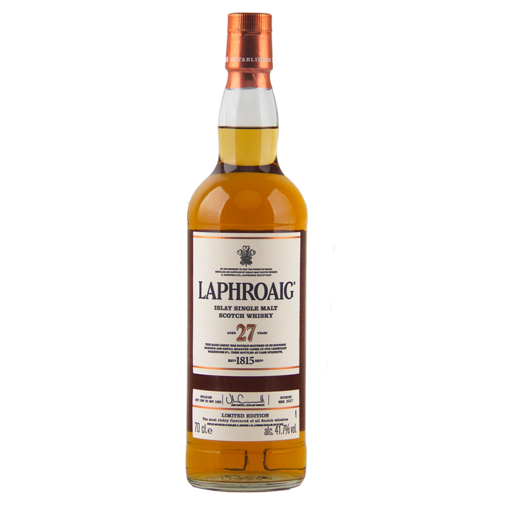 A bottle of Laphroaig 27 Year Old Single Malt Whisky with a white label, gold and red accents, and a brown cap, set against a plain white background—an exceptional investment-grade whisky.