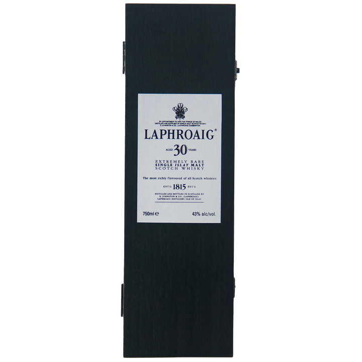 A rectangular black box with a white label reading Laphroaig 30 Year Old Limited Edition Single Malt Whisky, featuring details on this rare collectible and its alcohol content.