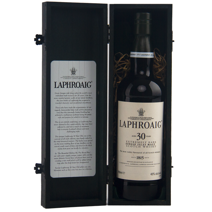 This rare Laphroaig 30 Year Old Limited Edition Single Malt Whisky is presented upright in a black wooden box, with a detailed description inside the lid.