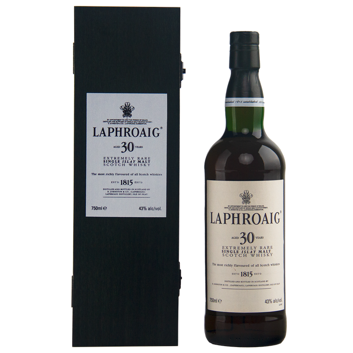 A rare collectible, the Laphroaig 30 Year Old Limited Edition Single Malt Whisky is shown beside its black presentation box, both displaying white labels with black text and the signature Laphroaig logo.