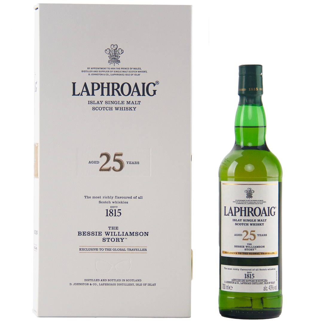 A bottle of Laphroaig Bessie Williamson Story 25 Year Old Limited Edition Whisky stands beside its white box with gold and black accents—a travel-retail exclusive honoring the Scotch distillery’s legendary founder.
