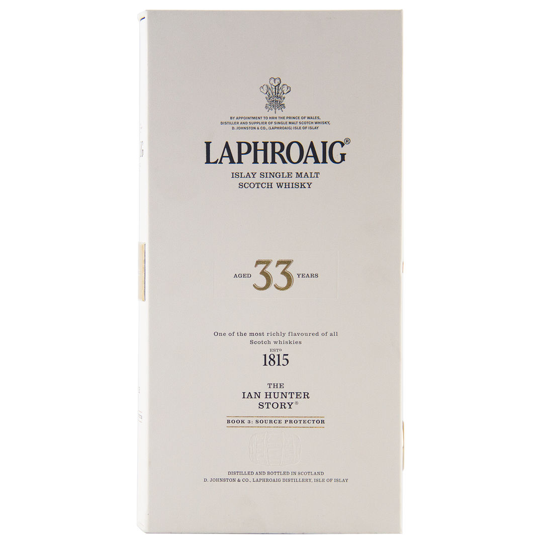 A white box of Laphroaig Ian Hunter Series Book 3 33 Year Old Single Malt Whisky features black text, gold accents, and showcases The Ian Hunter Story: Source Protector, making it a true collector's item.