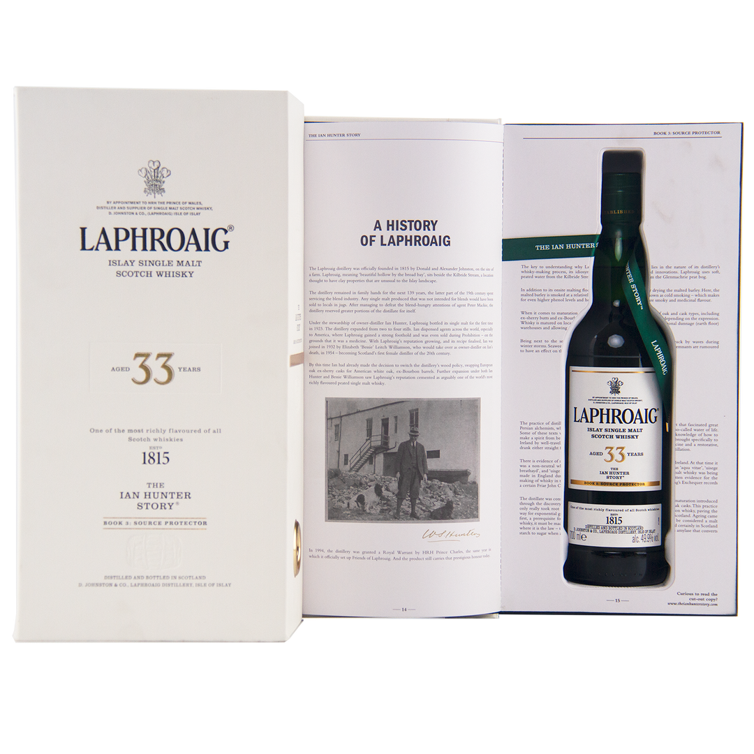 A box and open booklet showcase the Laphroaig Ian Hunter Series Book 3 33 Year Old Single Malt Whisky, featuring brand history text and a black-and-white portrait—an ideal gift for collectible whisky enthusiasts.