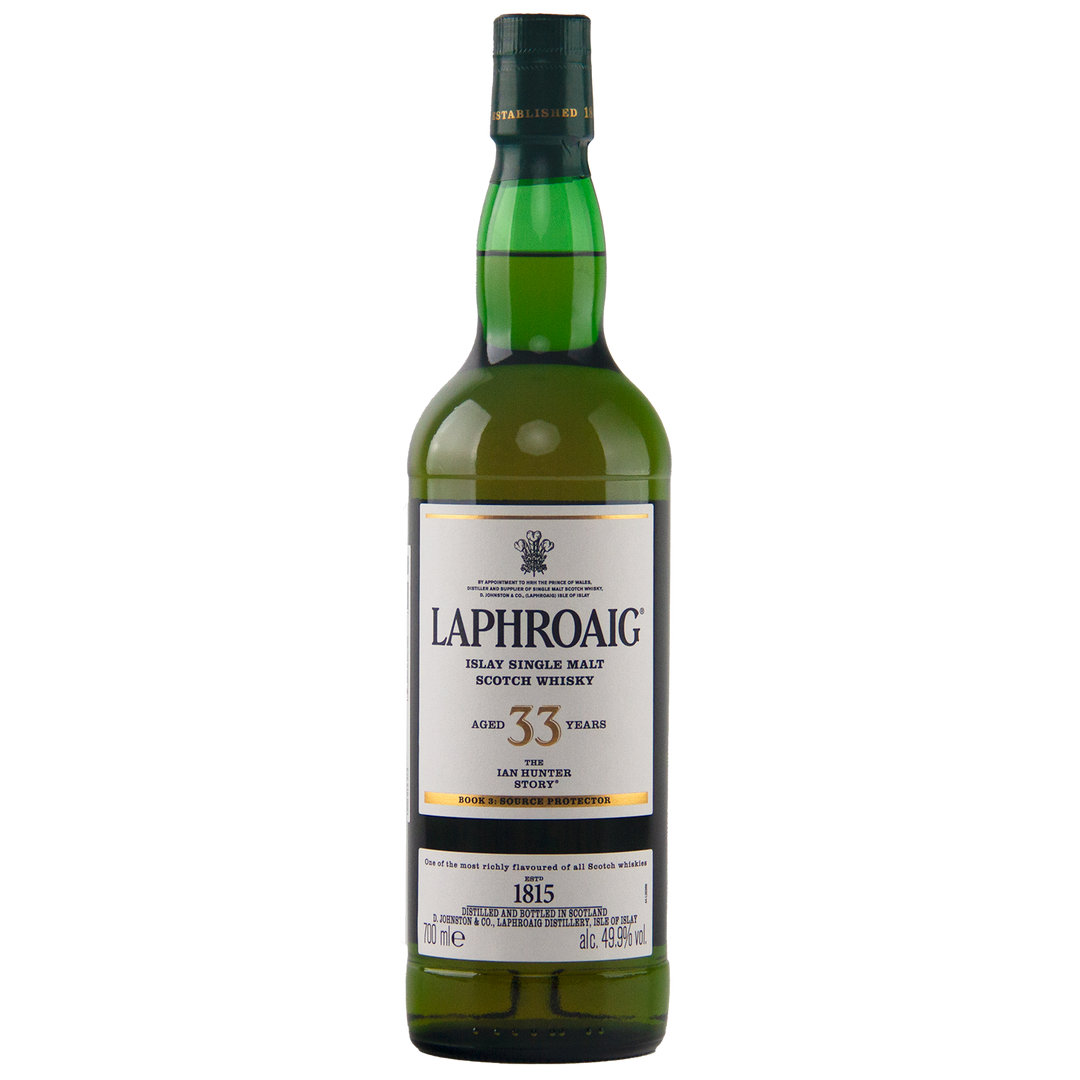A green bottle of Laphroaig Ian Hunter Series Book 3 33 Year Old Single Malt Whisky, with a white label and gold trim, stands upright on a white background—a true collectible for whisky enthusiasts.