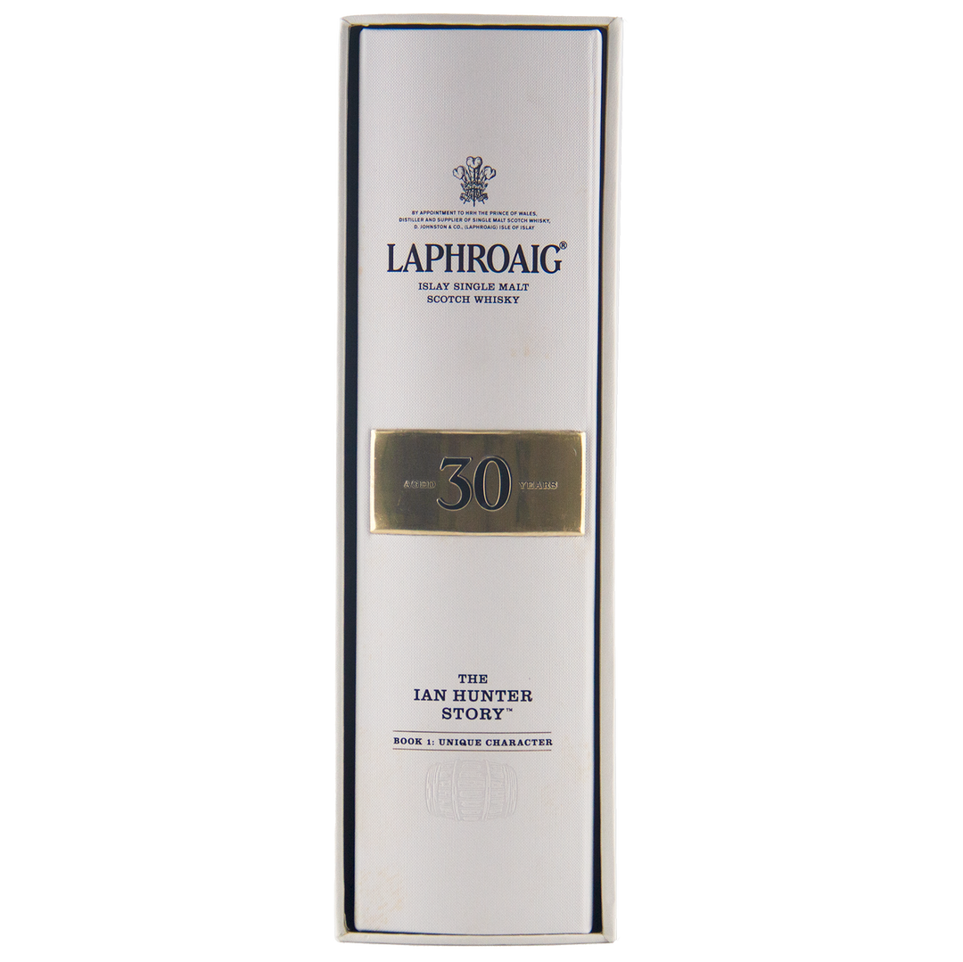 A white box branded Laphroaig Ian Hunter Story Book 1 with black text contains a bottle of the coveted 30 Year Old Single Malt Scotch Whisky from this collector’s series.