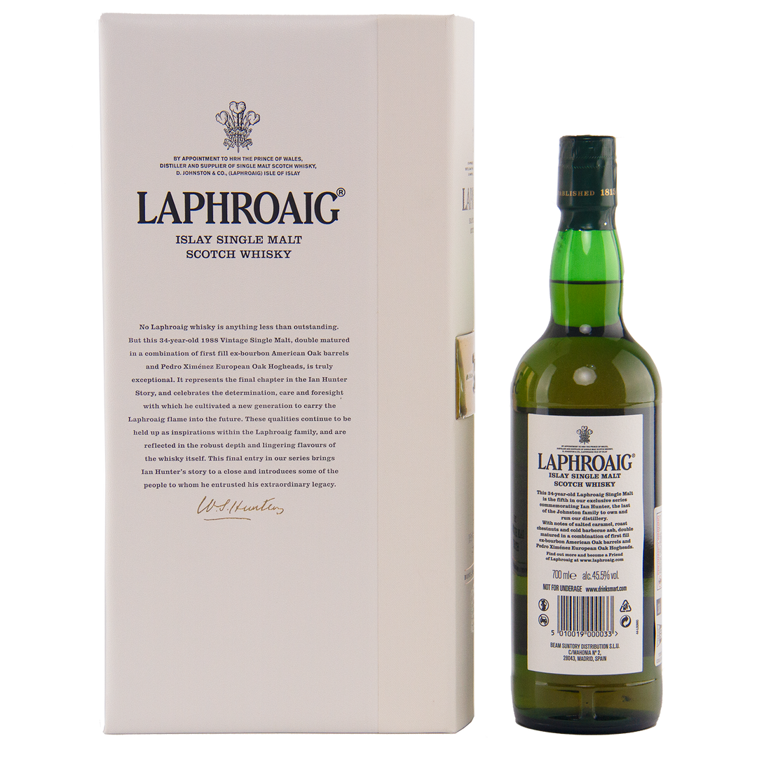 A bottle of Laphroaig Ian Hunter Story Book 5 34 Year Old Single Malt Whisky is displayed beside its white box, featuring detailed product info and black text. The green bottle has a classic white label.