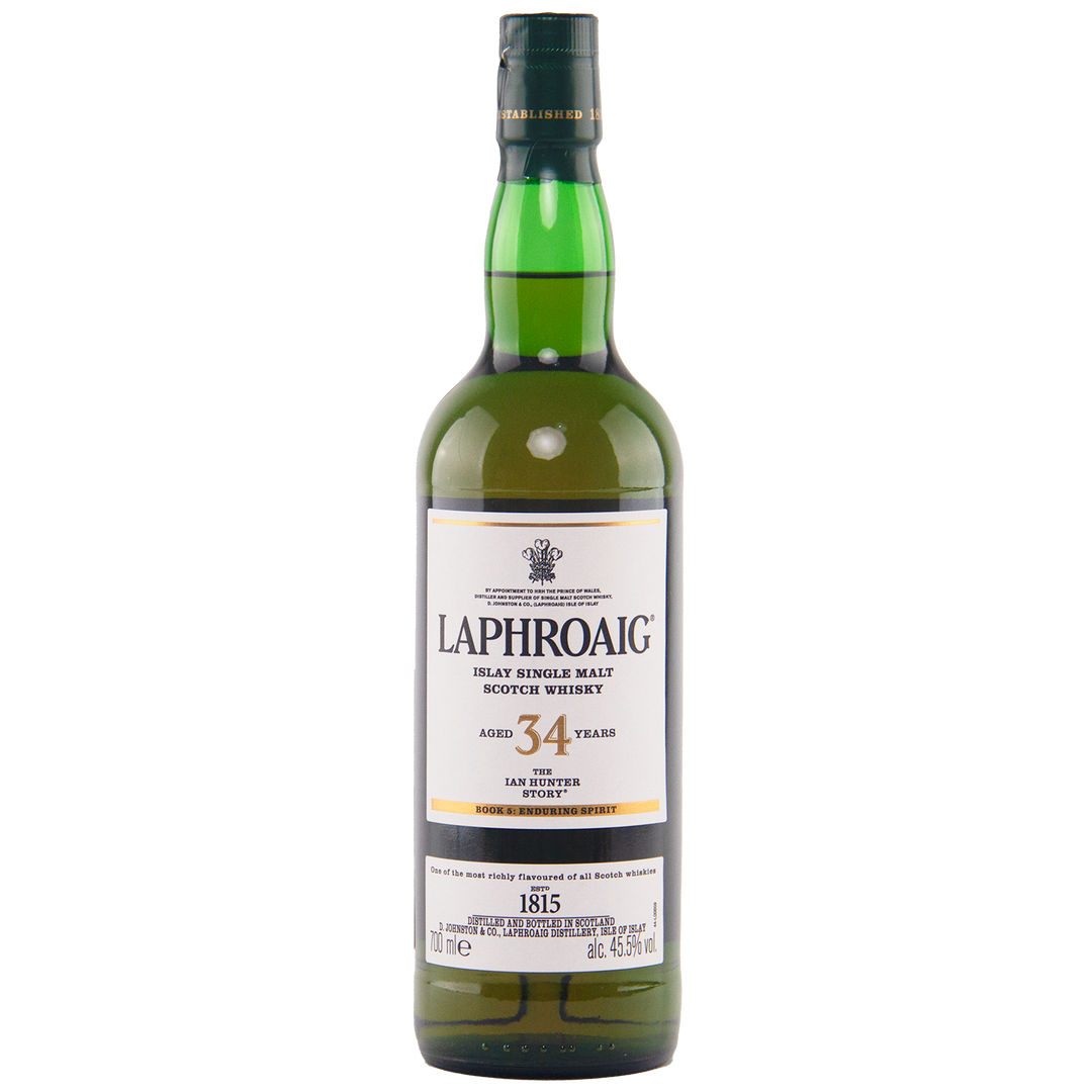 A bottle of Laphroaig Ian Hunter Story Book 5 34 Year Old Single Malt Whisky, an outstanding Islay single malt. It comes in a green bottle with a white label featuring black and gold text, topped by a green cap.