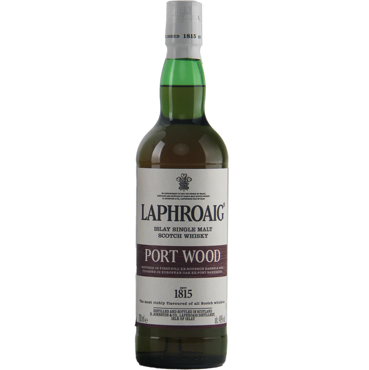 A green bottle of Laphroaig Port Wood Single Malt Whisky, showcasing a white label with brand details and the founding year, 1815; renowned for its distinct peated whisky character.
