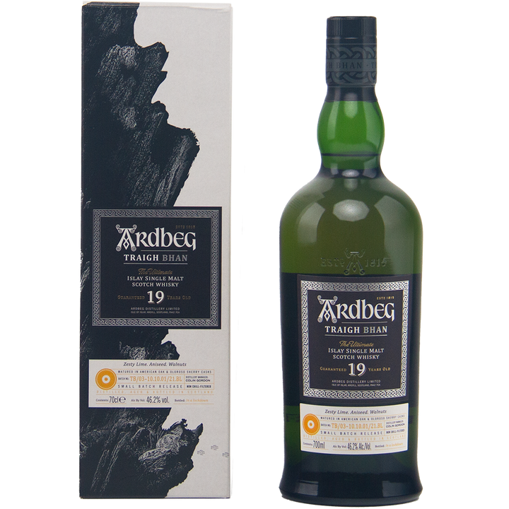 A bottle of Ardbeg Traigh Bhan 19 Year Old Batch 3 Single Malt Scotch Whisky stands next to its matching box, both adorned with black, white, and gold labels featuring intricate details—a classic Islay single malt look.