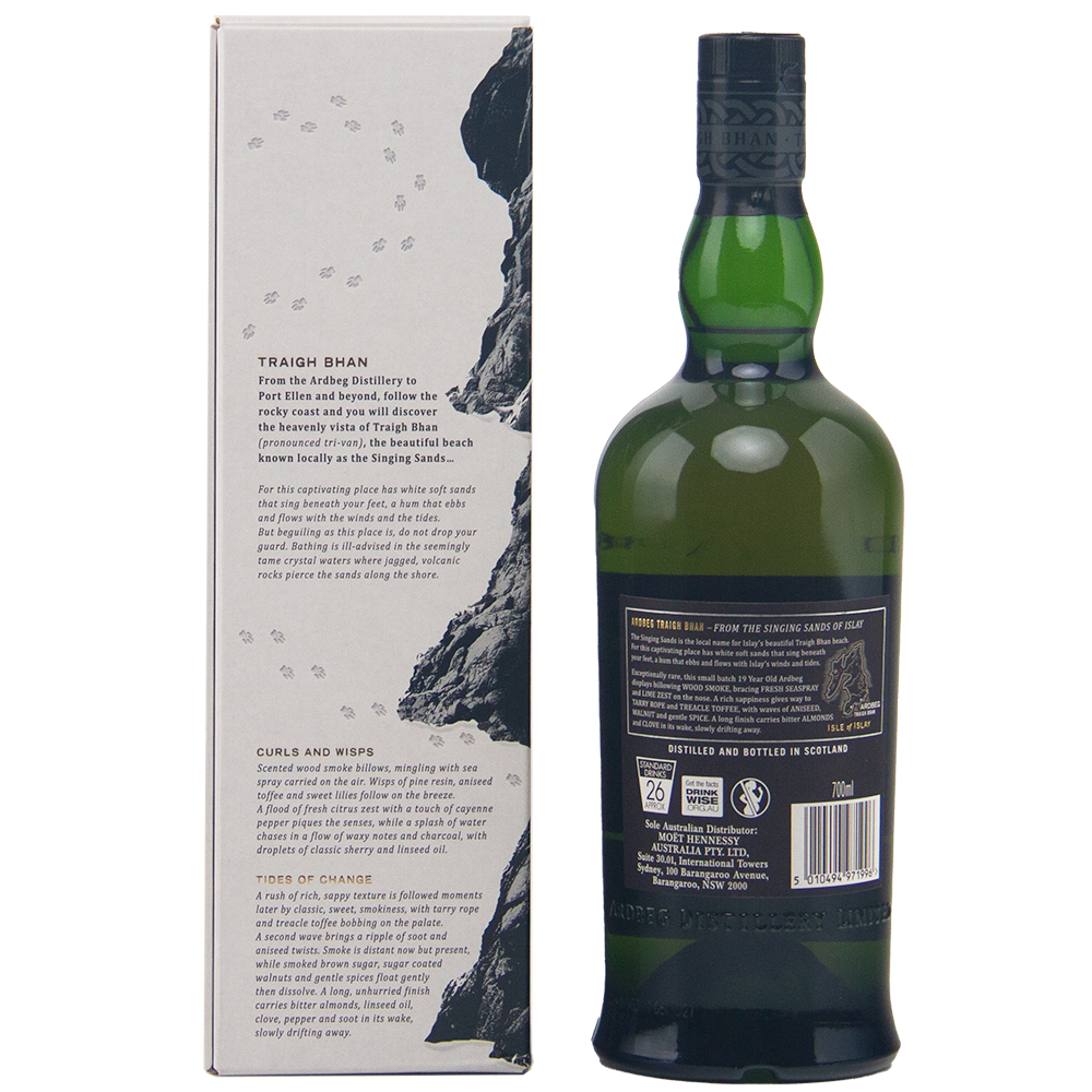 A bottle of Ardbeg Traigh Bhan 19 Year Old Batch 3 Single Malt Scotch Whisky stands beside its rock-inspired box with detailed text; the green bottle’s black label and cap emphasize this distinguished peated Islay malt.