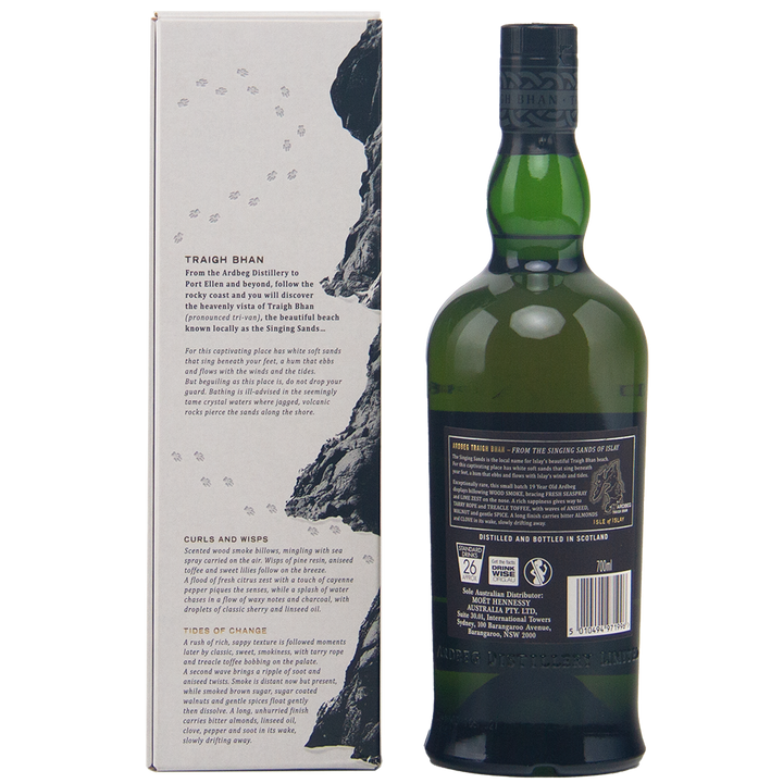 A bottle of Ardbeg Traigh Bhan 19 Year Old Batch 3 Single Malt Scotch Whisky stands beside its rock-inspired box with detailed text; the green bottle’s black label and cap emphasize this distinguished peated Islay malt.