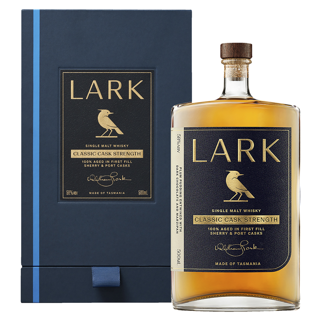 A bottle of Lark Cask Strength Tasmanian Single Malt Whisky with a gold label and bird logo is displayed in front of its coordinating dark blue and gold presentation box.