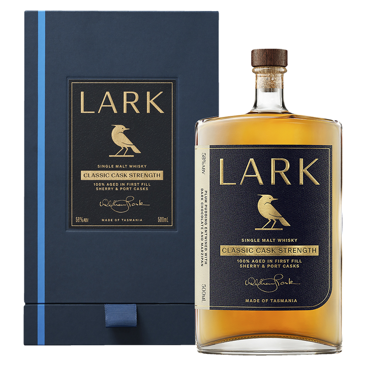 A bottle of Lark Cask Strength Tasmanian Single Malt Whisky with a gold label and bird logo is displayed in front of its coordinating dark blue and gold presentation box.