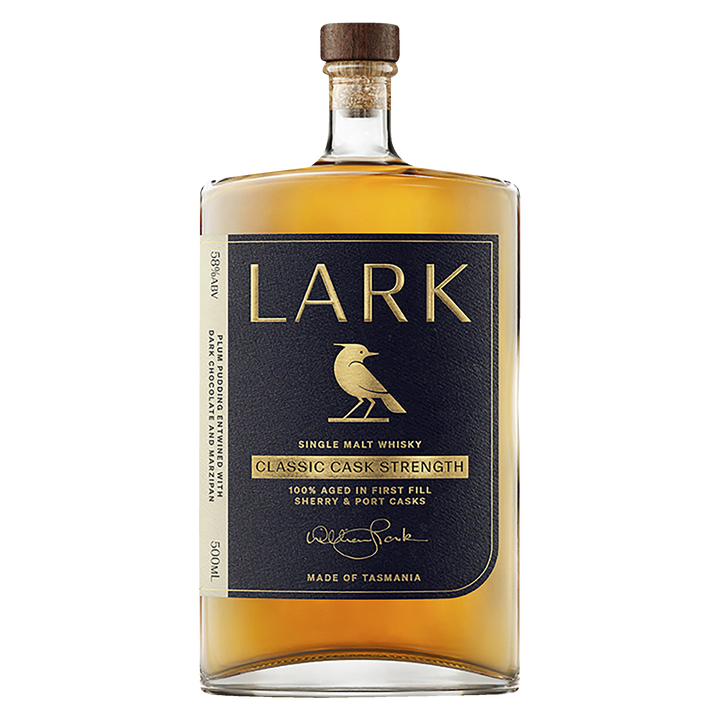 A bottle of Lark Cask Strength Tasmanian Single Malt Whisky features a dark blue and gold label with a bird logo, the words "Classic Cask Strength," a wooden cork, and is filled with golden cask strength whisky.
