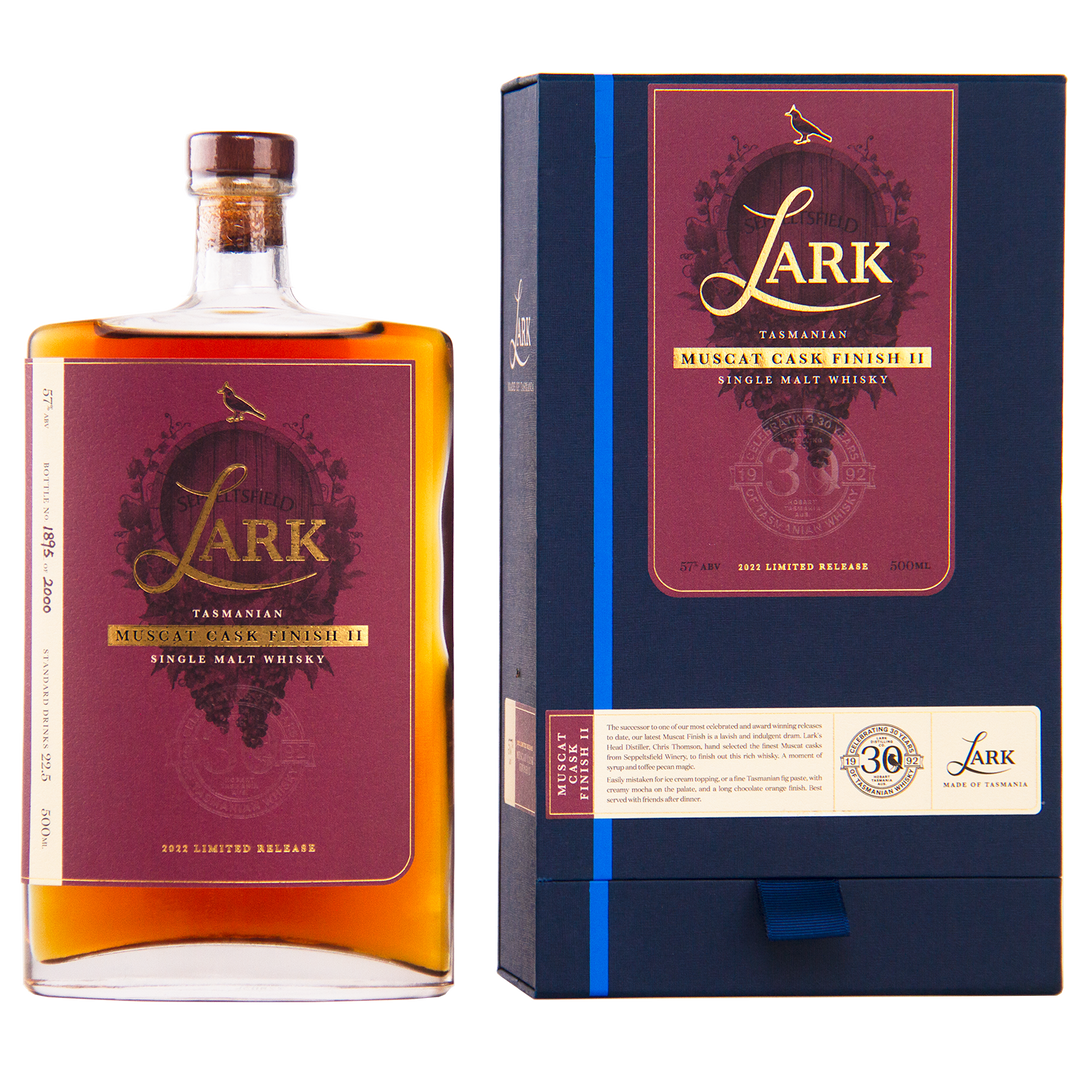 A bottle and box of Lark Muscat Cask Finish II Single Malt Whisky, featuring a rectangular bottle with a maroon label and a dark blue box accented in gold and maroon.