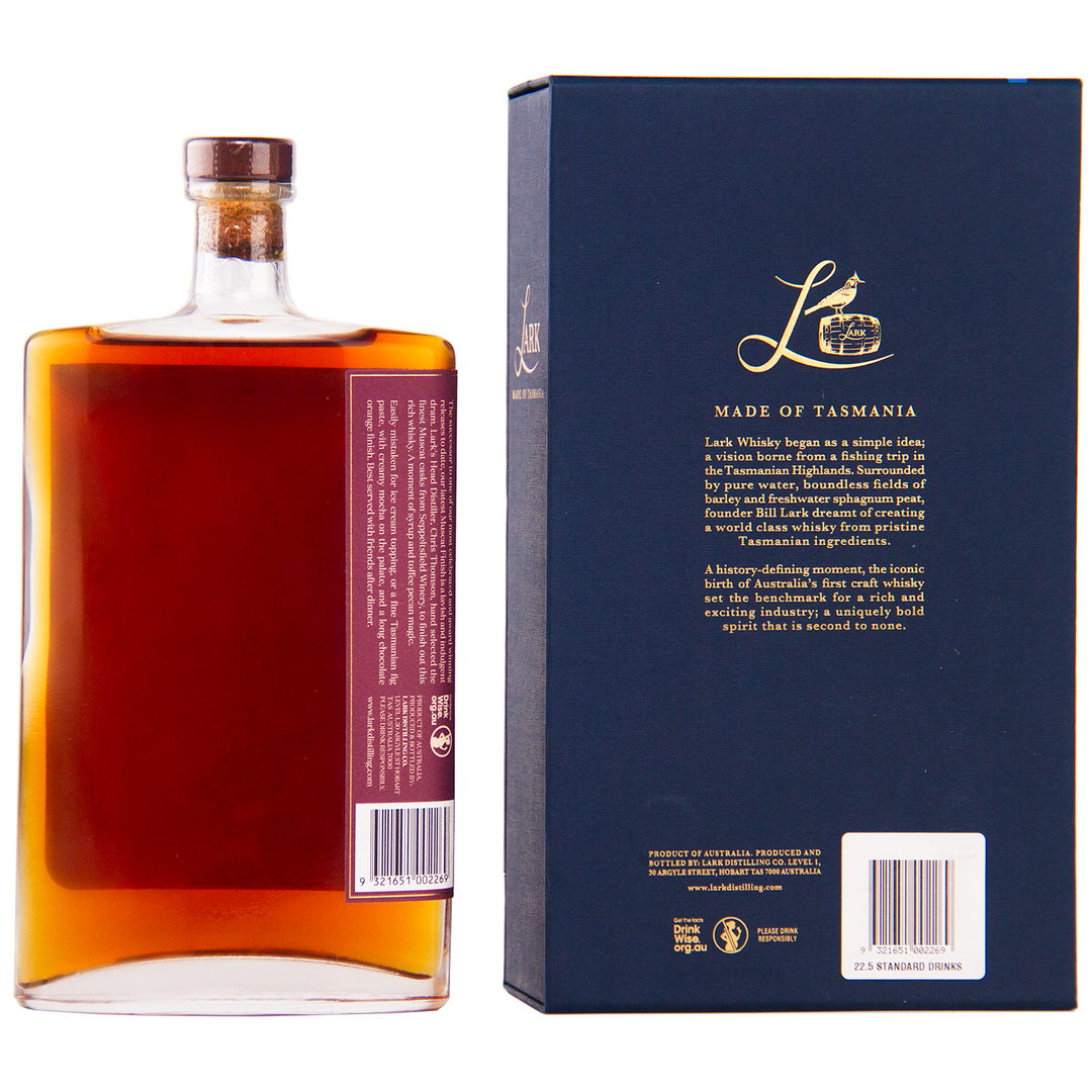 A rectangular bottle of Lark Muscat Cask Finish II Single Malt Whisky with a wooden cap sits next to its dark blue box. The box features gold text, a barcode, and highlights its Tasmanian origin and muscat cask finish.
