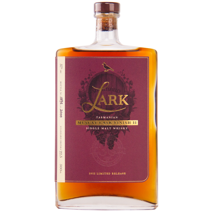 A rectangular bottle of Lark Muscat Cask Finish II Single Malt Whisky (2021), featuring amber liquid and a maroon and gold label with a bird motif, highlights its muscat cask finish.