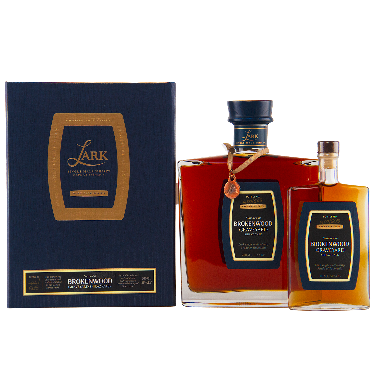 Two bottles of Lark Brokenwood Graveyard Shiraz Rare Cask Single Malt Whisky, one large and one small, with square bodies and black-gold labels, are displayed beside a dark blue and gold gift box bearing the product name.