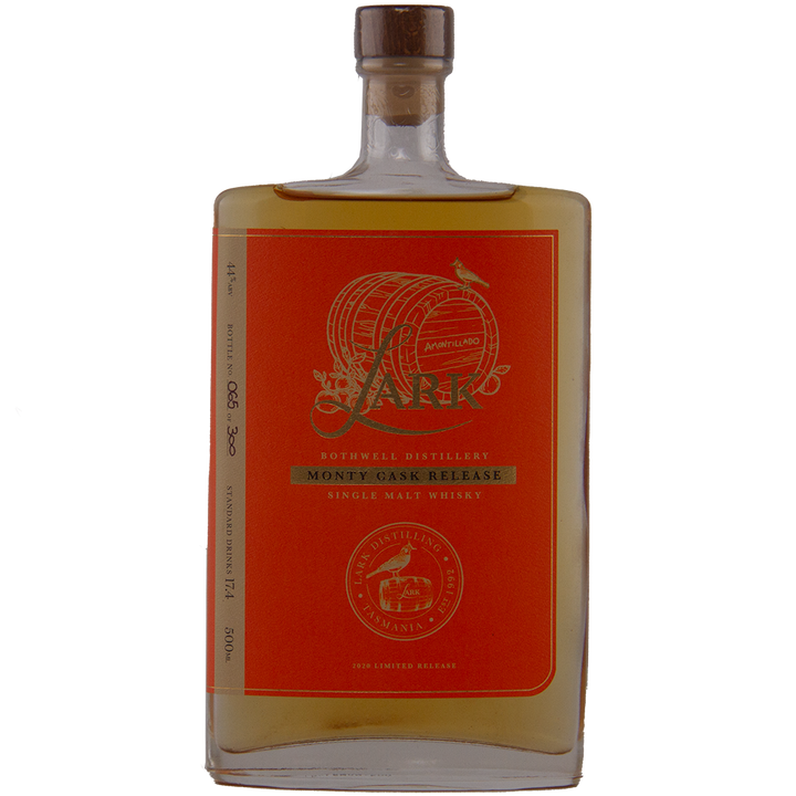 A rectangular bottle of Lark Monty Cask Release Single Malt Whisky with a red and gold label contains amber liquid. This wooden-capped, limited edition 2020 release is matured in Amontillado cask.