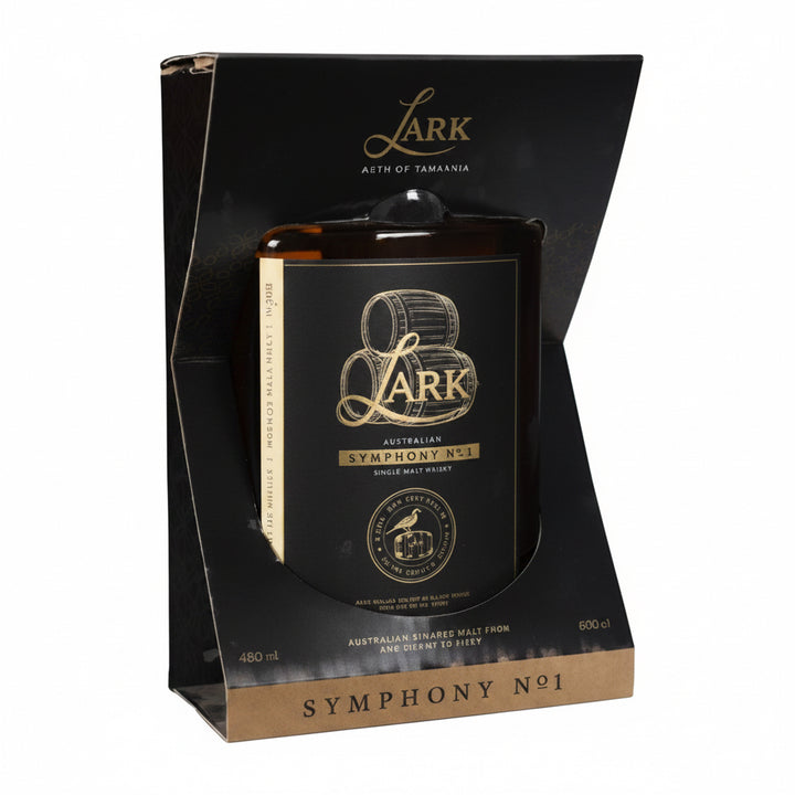 A boxed dark amber glass candle with gold lettering, displayed inside a black presentation box labeled Lark Symphony No. 1.