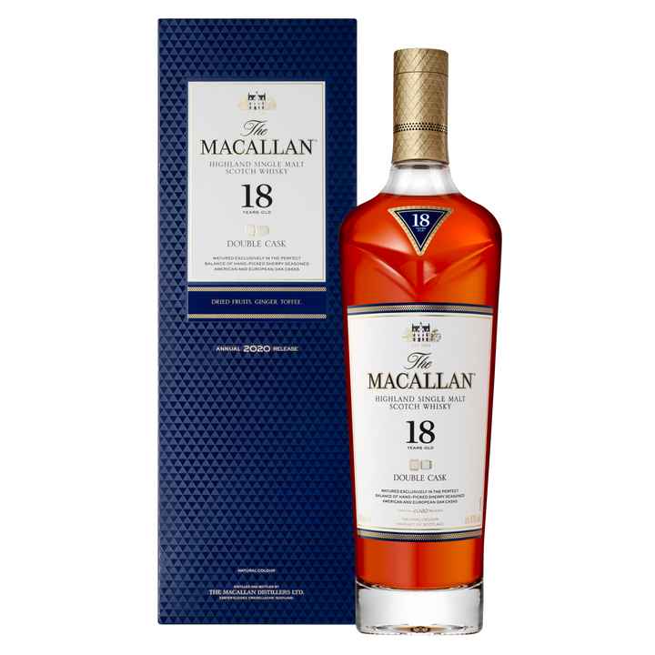 A bottle of The Macallan Double Cask 18 Year Old Single Malt Scotch Whisky stands beside its blue patterned box, both displaying gold and white labels that emphasize its sherry cask maturation.