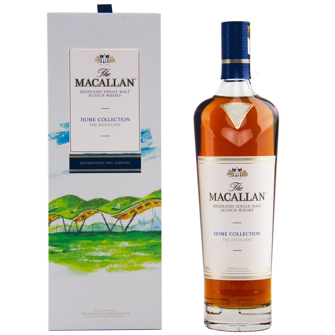 A bottle of The Macallan Home Collection The Distillery Single Malt Scotch Whisky sits beside its decorative box, adorned with green hills and an arched distillery illustration—a must-have collectible for whisky enthusiasts.