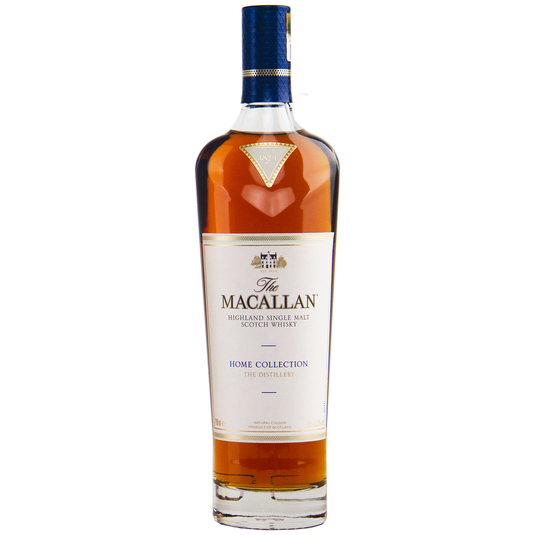 A collectible, The Macallan Home Collection The Distillery Single Malt Scotch Whisky features a white label with gold and blue accents, showcasing its rich amber liquid inside.