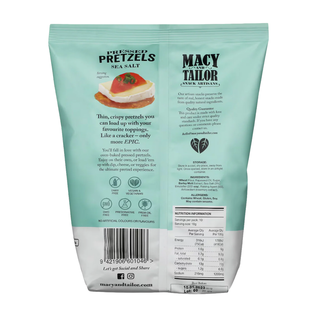The teal bag of Macy and Tailor Pressed Pretzels Sea Salt features natural ingredients, nutrition facts, serving suggestions, and allergy warnings in bold black and white text.