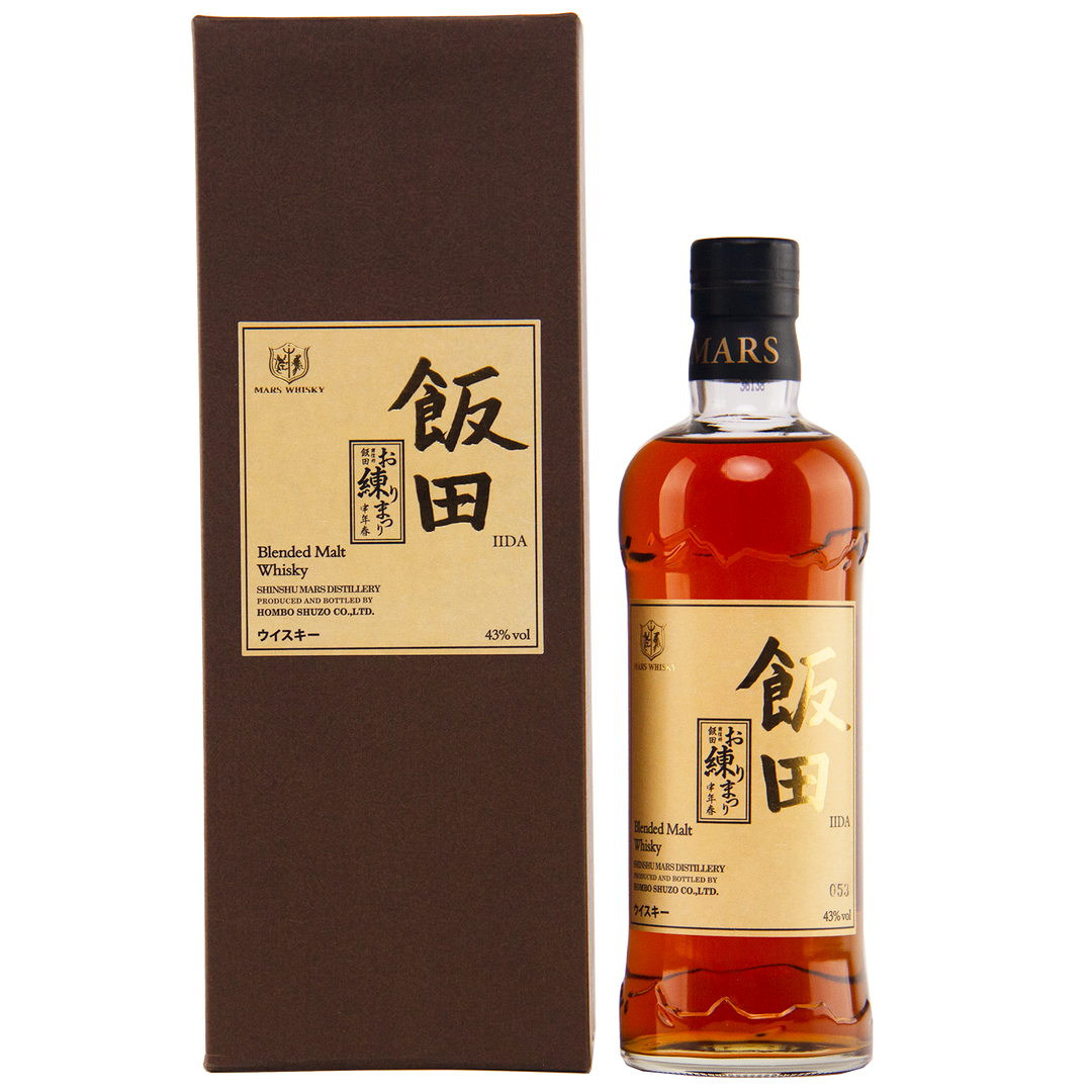 A bottle of Mars Blended Malty Whisky in a brown box, both featuring gold labels with Japanese and English text and the Mars Distillery logo. Collectible Japanese whisky presentation.