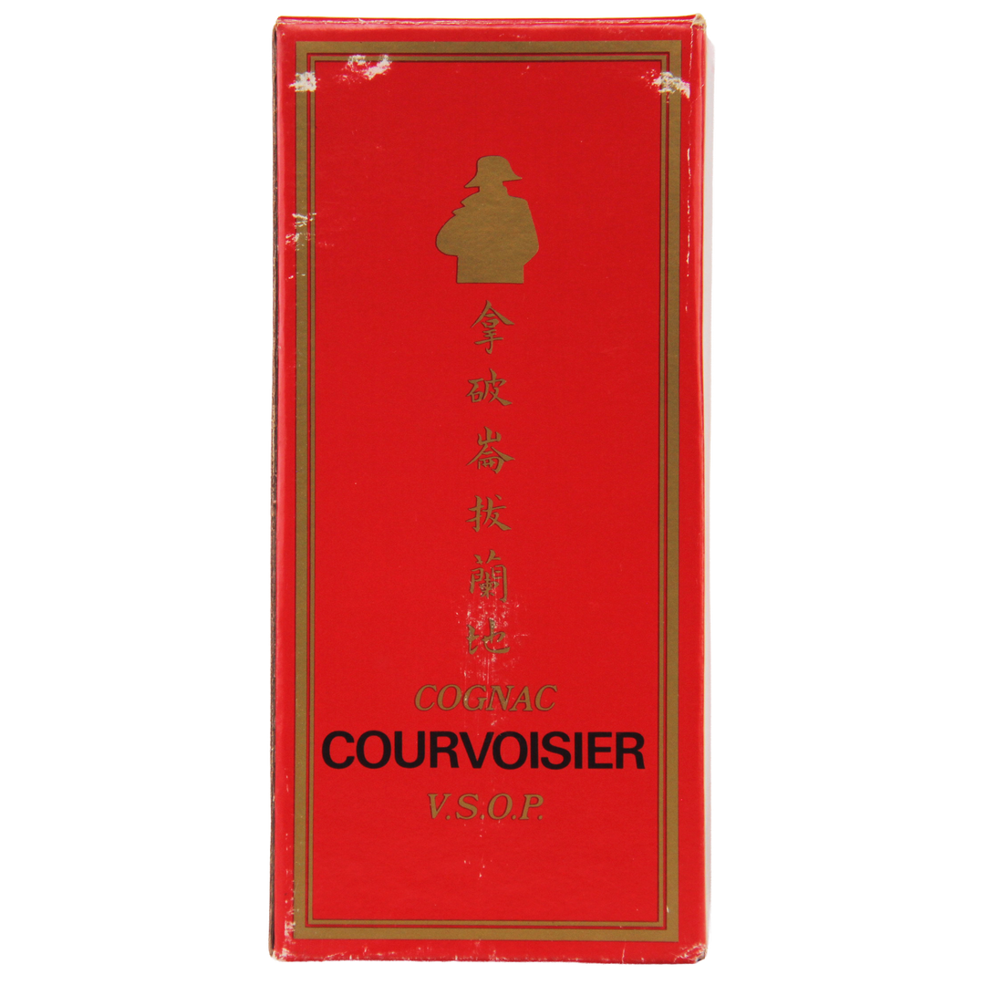 Red Courvoisier cognac box with gold accents on a white background