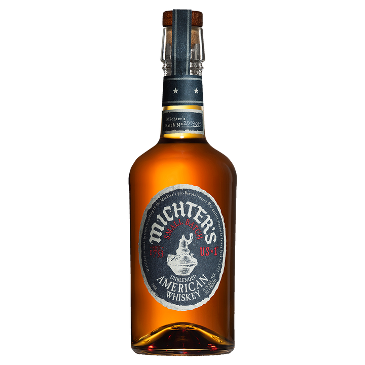 A bottle of Michter's US*1 American Whiskey, featuring a dark glass body, black and silver label, and cork stopper, is displayed against a white background.