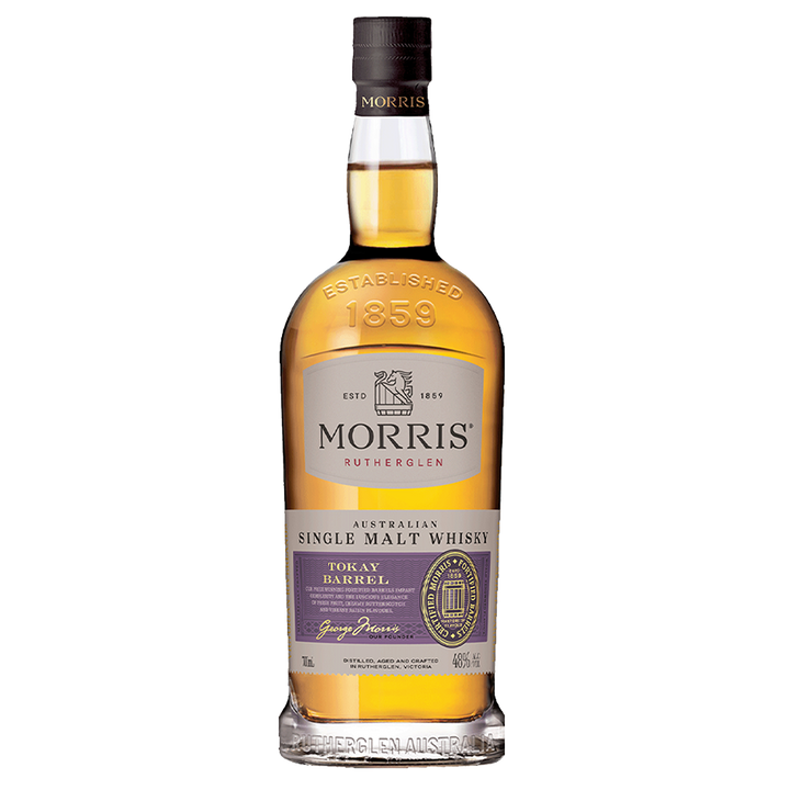 A bottle of Morris Tokay Barrel Australian Single Malt Whisky features a purple and gold label with the brand name and 46% ABV, showcasing a rich gold liquid inside.