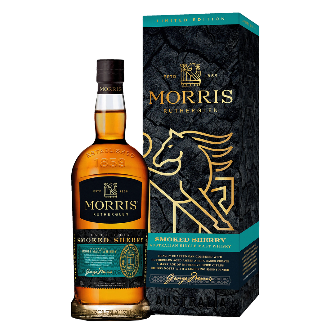 A bottle of Morris Whisky Smoked Sherry Australian Single Malt Whisky stands next to its matching box, both featuring gold accents, a stylized lion, and teal highlights for this limited edition smoked sherry cask release.