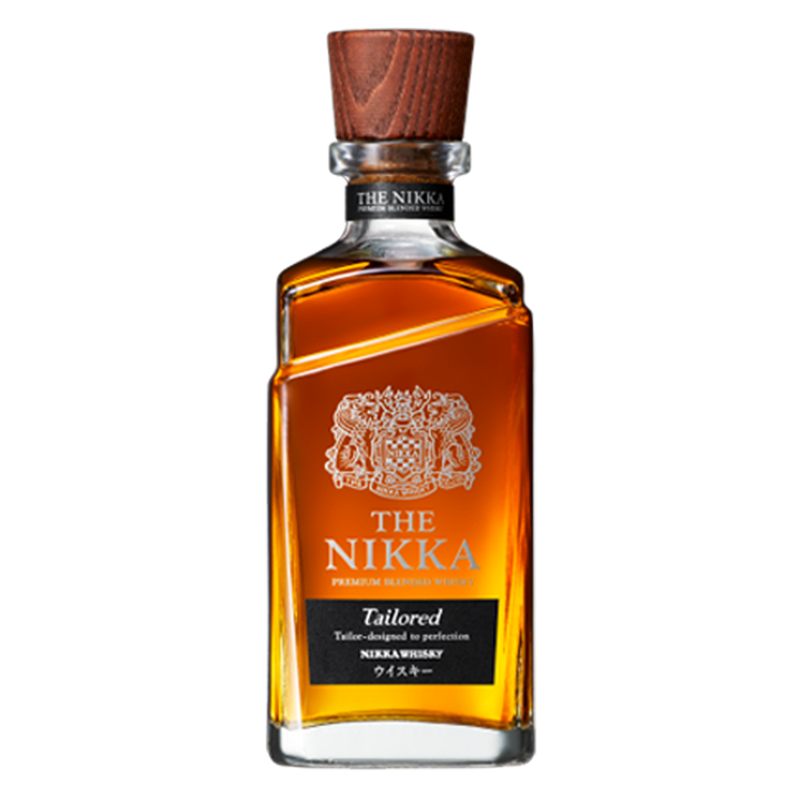 A bottle of Nikka Tailored Blended Japanese Whisky features a wooden cap, clear glass showcasing amber liquid, and a label with gold and white text plus a decorative crest above the brand name.