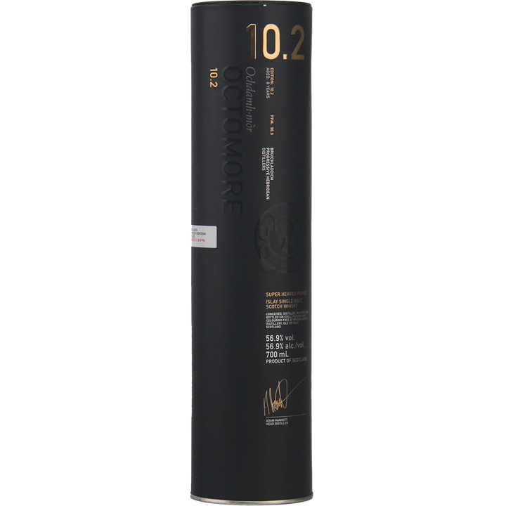 A tall, cylindrical black container with gold text displays Bruichladdich Octomore 10.2 Cask Strength Single Malt Scotch Whisky, a heavily peated whisky. The packaging features embossed and printed details, including alcohol volume and signature.